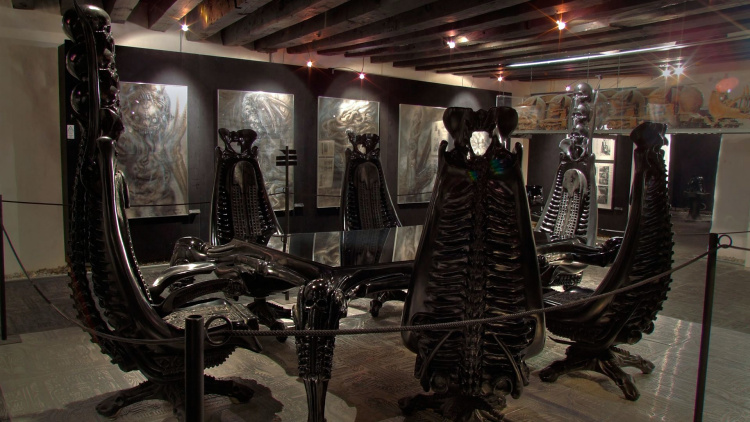 Giger’s amazing Harkonnen table set, surrounded by his surreal paintings